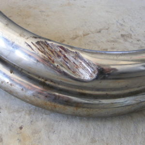 Dent on header pipe #4