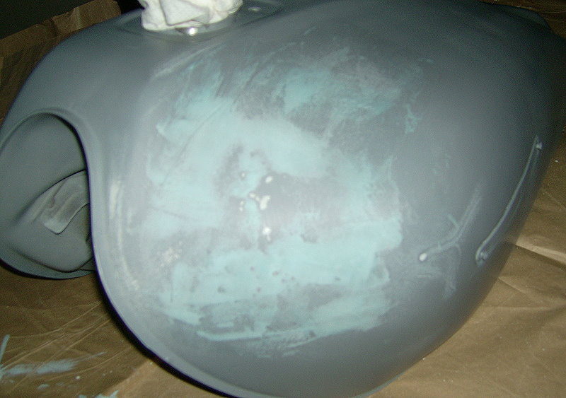 Tank with primer and filler